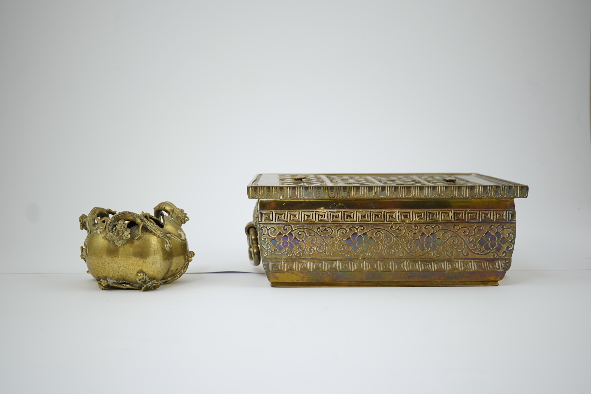 A large Chinese bronze rectangular censer and cover, Xuande seal mark, and a ‘plum blossom and chilong’ bronze censer, both 19th century